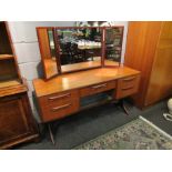 A G-Plan teak dressing table with three fold mirror