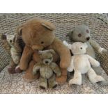 Five various teddies including care worn mohair with stitched eyes