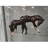 A large Beswick Foal in brown gloss, head down,