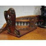 A Victorian walnut bookstand with brass scrolled mounts