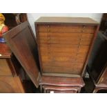 An early 20th Century oak engineer's/specimen cabinet with eleven graduating drawers and front