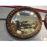 A large Edwardian oval Barbola mirror,
