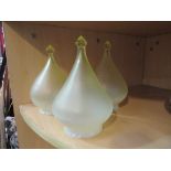 Three green and milky glass lamp shades etc