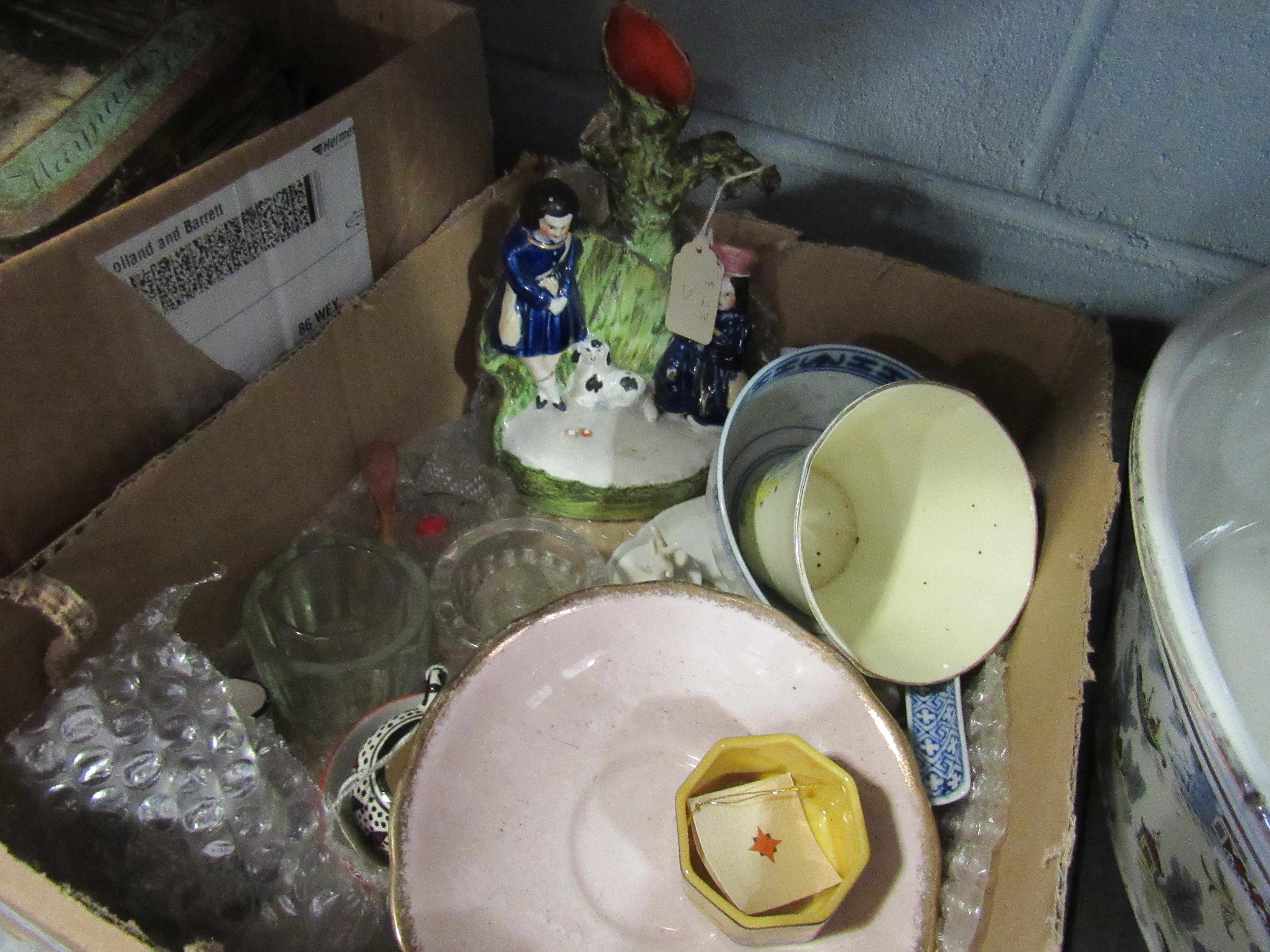 A box of miscellaneous items including spill vase