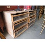 A six drawer fitted shop unit with glazed fronted drawers 130w x 47d x 70h cm