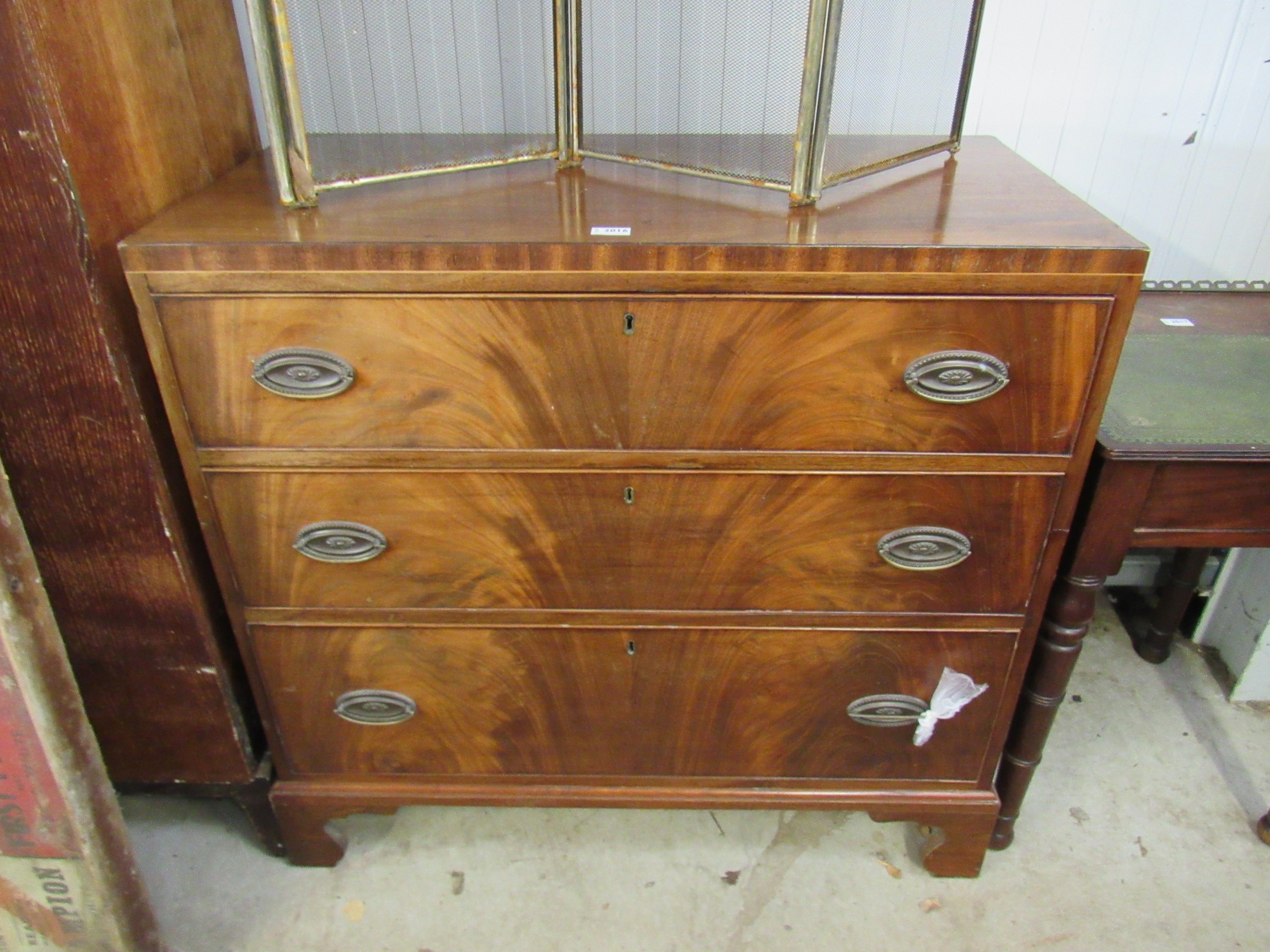 A Georgian flamed mahogany split chest of three drawers 99w x 47d x 95h cm