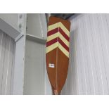A decorative wall hanging oar ,
