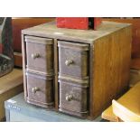 A 1930's oak bank of four drawers,