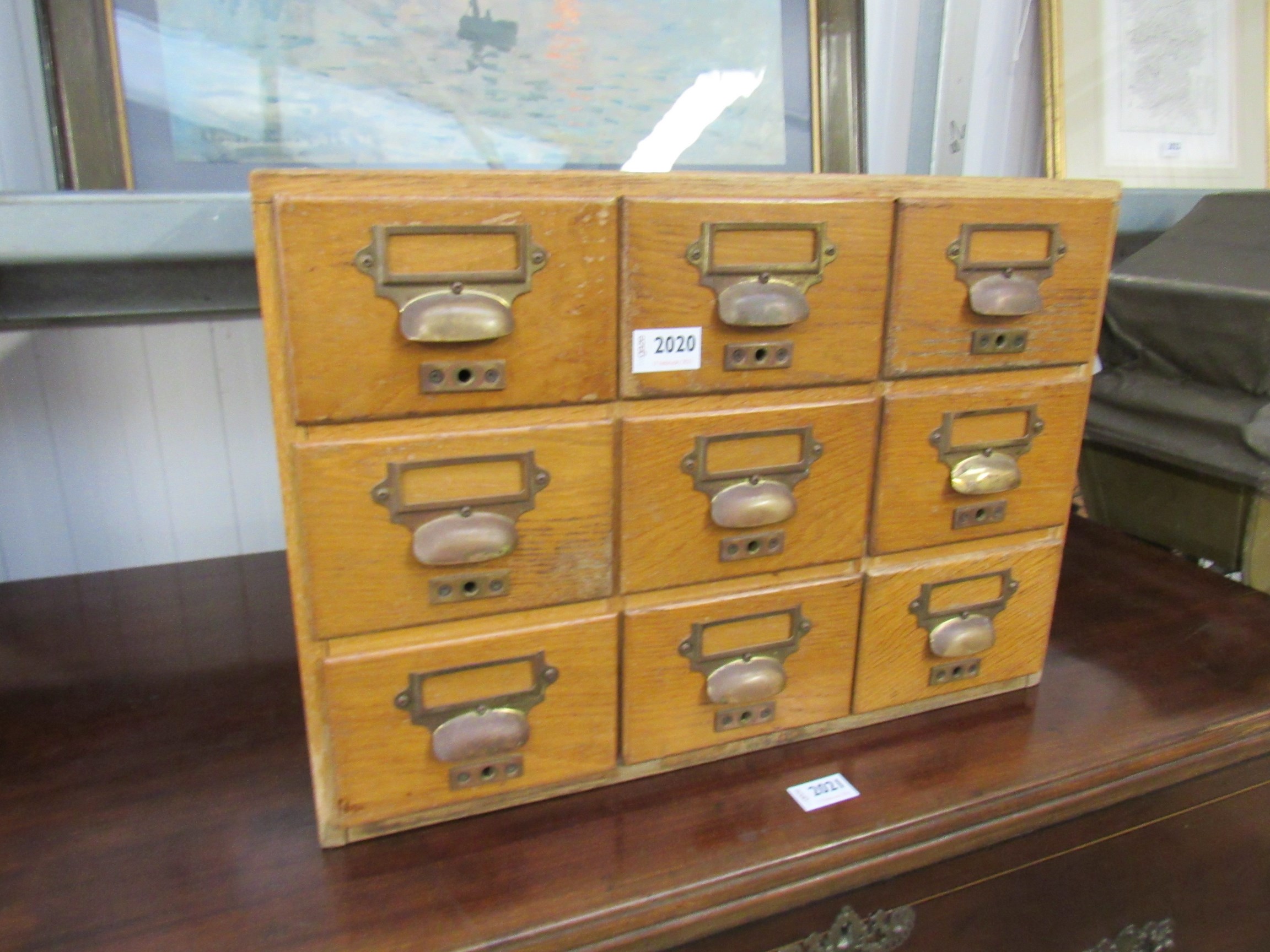 An oak nine drawer haberdashery unit "Coats Satinised" 91w x 40d x 36h cm