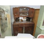 A French oak kitchen unit with mirrored back