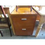 A 1970's teak two drawer filing cabinet