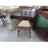 An Edwardian mahogany chair with turned spindle back rest