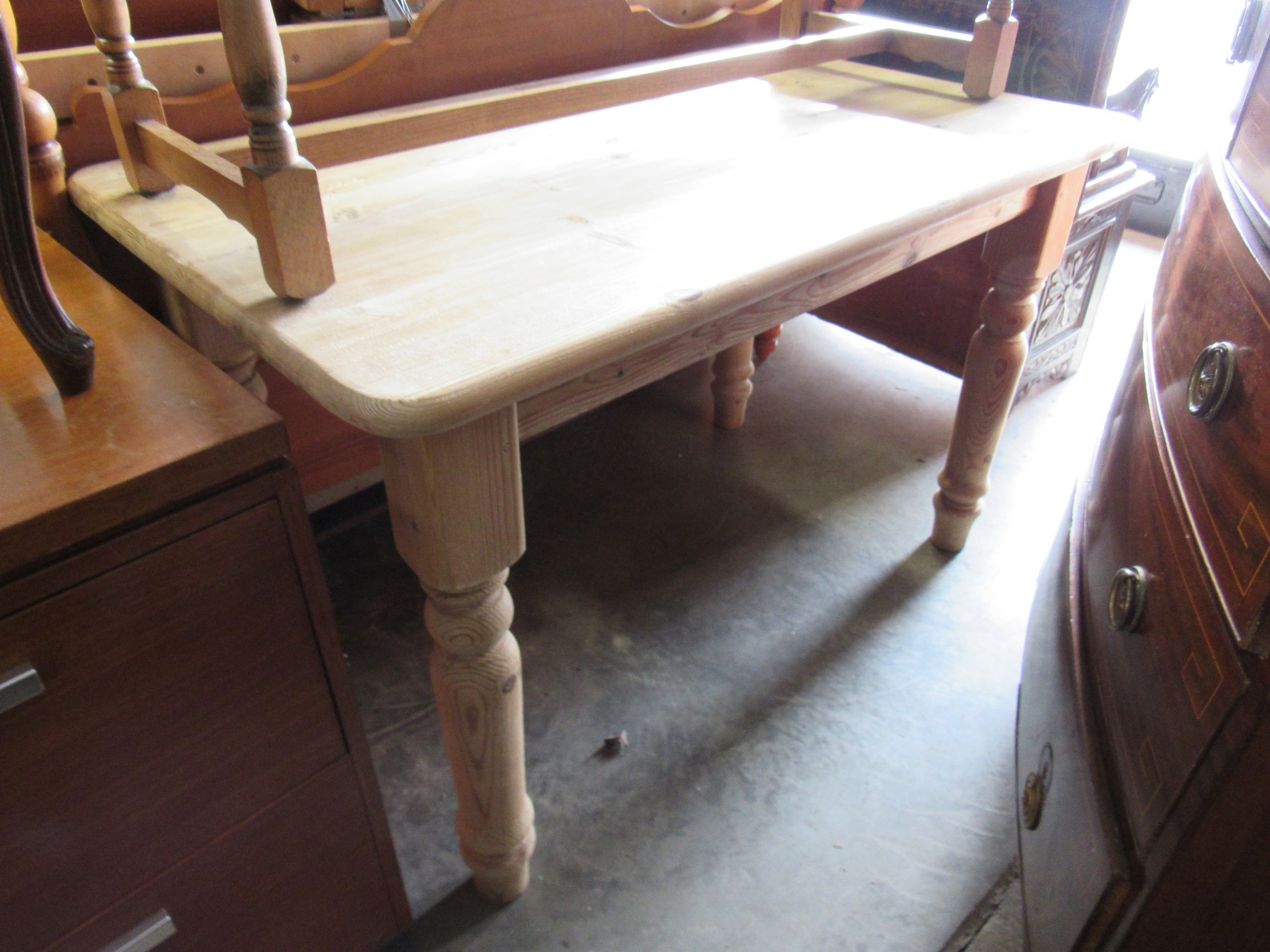 A modern stripped pine country farmhouse table 122w x 76d x 76h cm