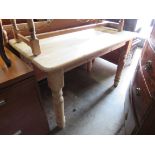 A modern stripped pine country farmhouse table 122w x 76d x 76h cm