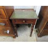 A small Georgian mahogany desk with green leather top and gilt brass gallery over a single drawer