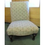 A Victorian mahogany nursing chair the bow front seat over turned legs