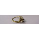 A gold ring with ruby trefoil and diamond trefoil set in a twist, 18ct gold. Size M, 2.