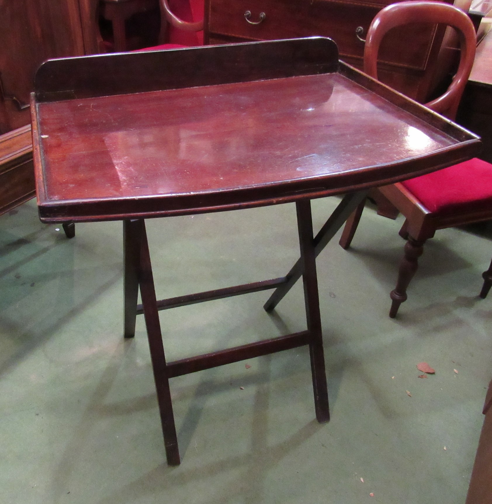 A 19th Century butlers tray with collapsible stand