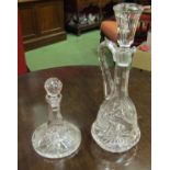 A cut glass claret jug and cut glass liqueur decanter