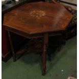 A Victorian inlaid rosewood two tier centre table the octagonal top over turned legs and ceramic