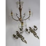A pair of ormolu wall sconces and a three branch electrolier