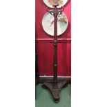 A Victorian mahogany coat stand with triform base,