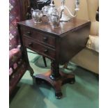 A circa 1840 mahogany work table the rising leaves and two drawers over a turned column on a