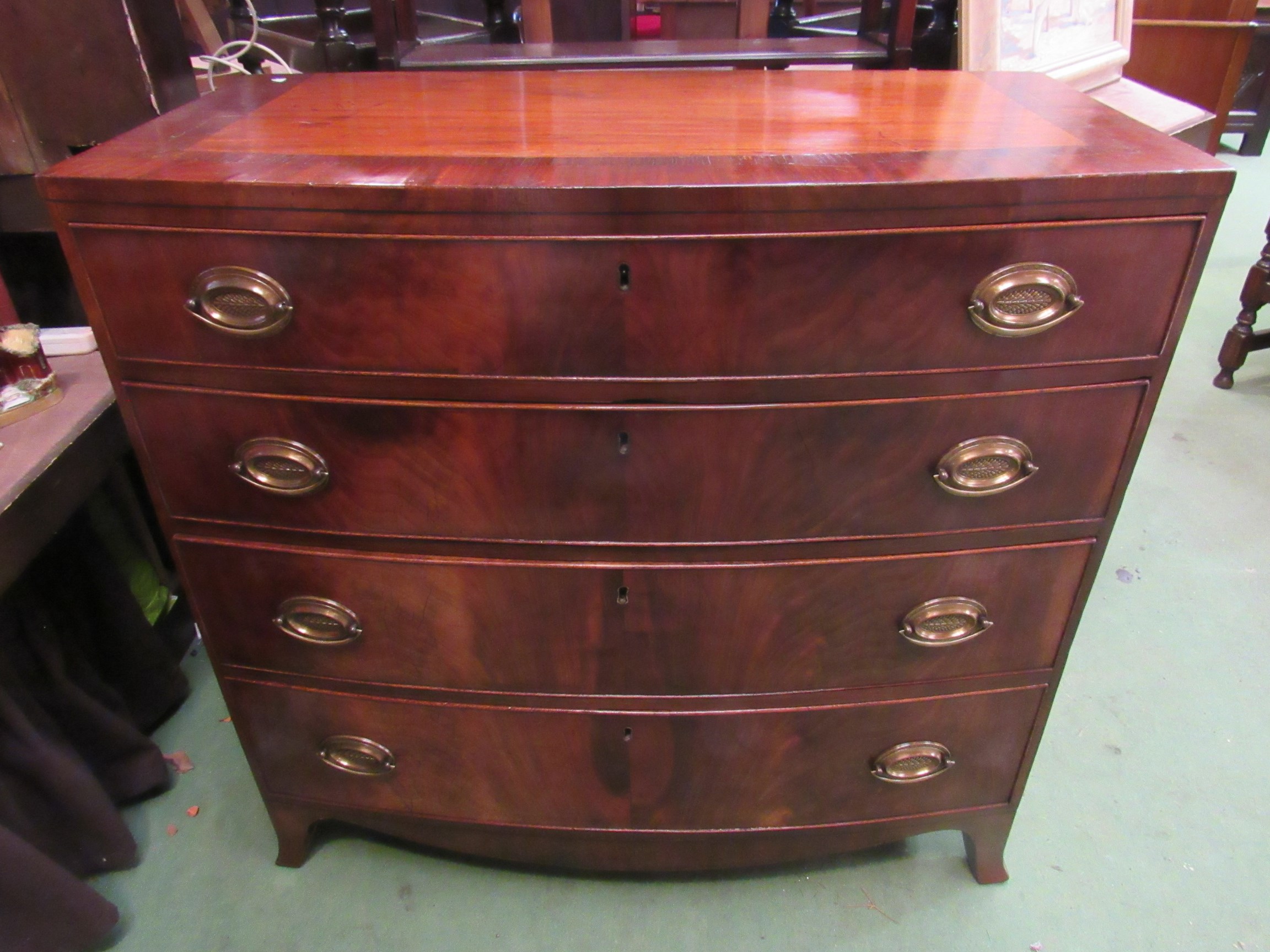An early Victorian crossbanded mahogany bow front chest of four graduating long drawers with brass - Image 2 of 2