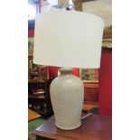 A stoneware lamp with shade,