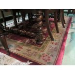 A red ground Chinese rug,