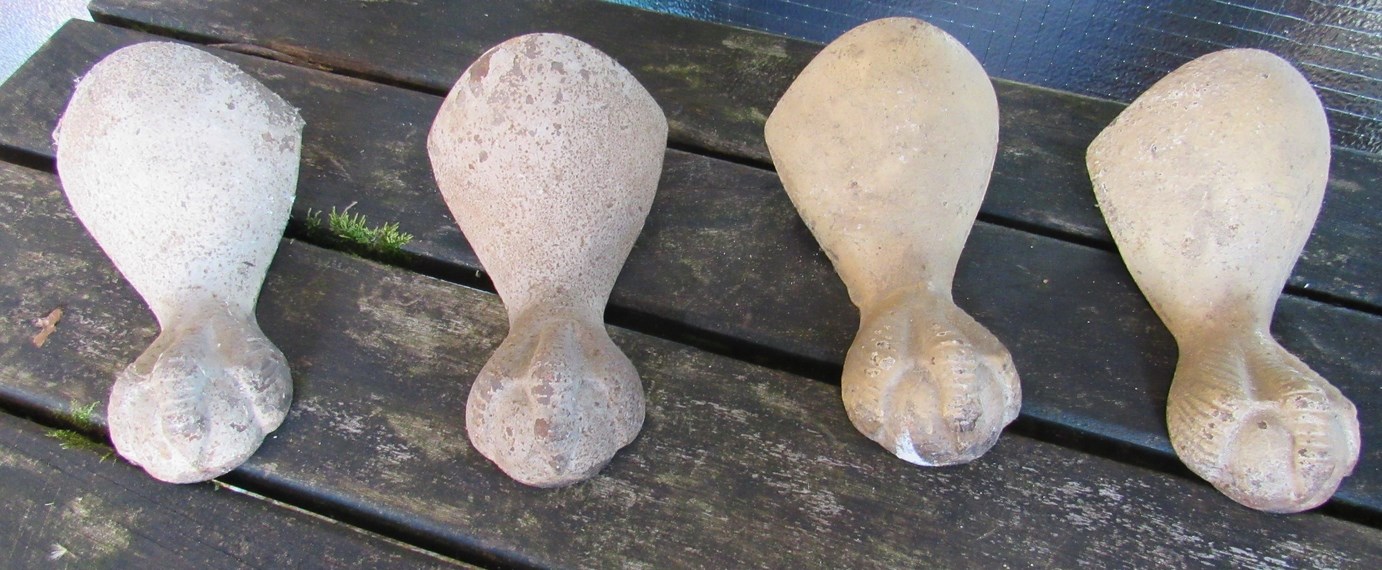 Four cast metal ball and claw bath feet