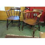 A near pair of late 19th/early 20th Century elm seated captains chairs with turned spindle backs,