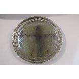 An ornate electroplated salver with pierced border,