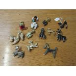 12 poodle brooches of varying designs