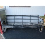 A 19th Century strap iron four seater bench,