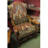An 18th Century style carved walnut open armchair with acanthus leaf scroll arms and upholstery
