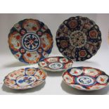 Two early 20th century Japanese Imari chargers and three plates,