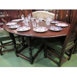 An 18th Century and later oval top drop leaf dining table with single end cutlery drawer over