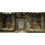 A pair of gilt framed oleographs of elegant ladies,