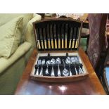 An oak cased canteen of cutlery