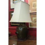 A salt glazed flagon lamp,