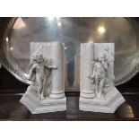 A pair of "Hide & Seek" cherub book-ends,