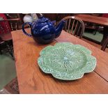 A large blue London Pottery teapot and cabbage serving plate