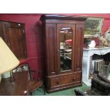 A Victorian walnut single wardrobe, the mirror door with key over a single base drawer,