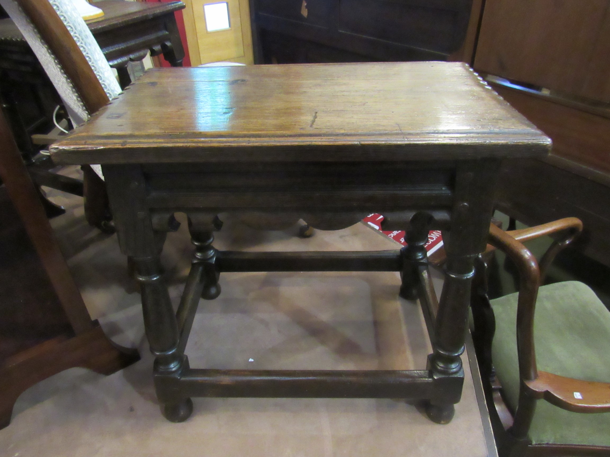 A pair of pegged oak joined stools with chip carved seat over fretwork friezes on turned legs - Image 2 of 2