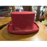 A Christys red top hat,