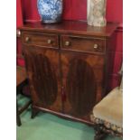 A George III style mahogany side cabinet the two frieze drawers over a two door cupboard with key