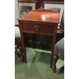 An Edwardian line inlaid mahogany lamp table, the single drawer over square tapering legs,