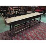 A Victorian oak joined long stool/bench with wavy frieze,