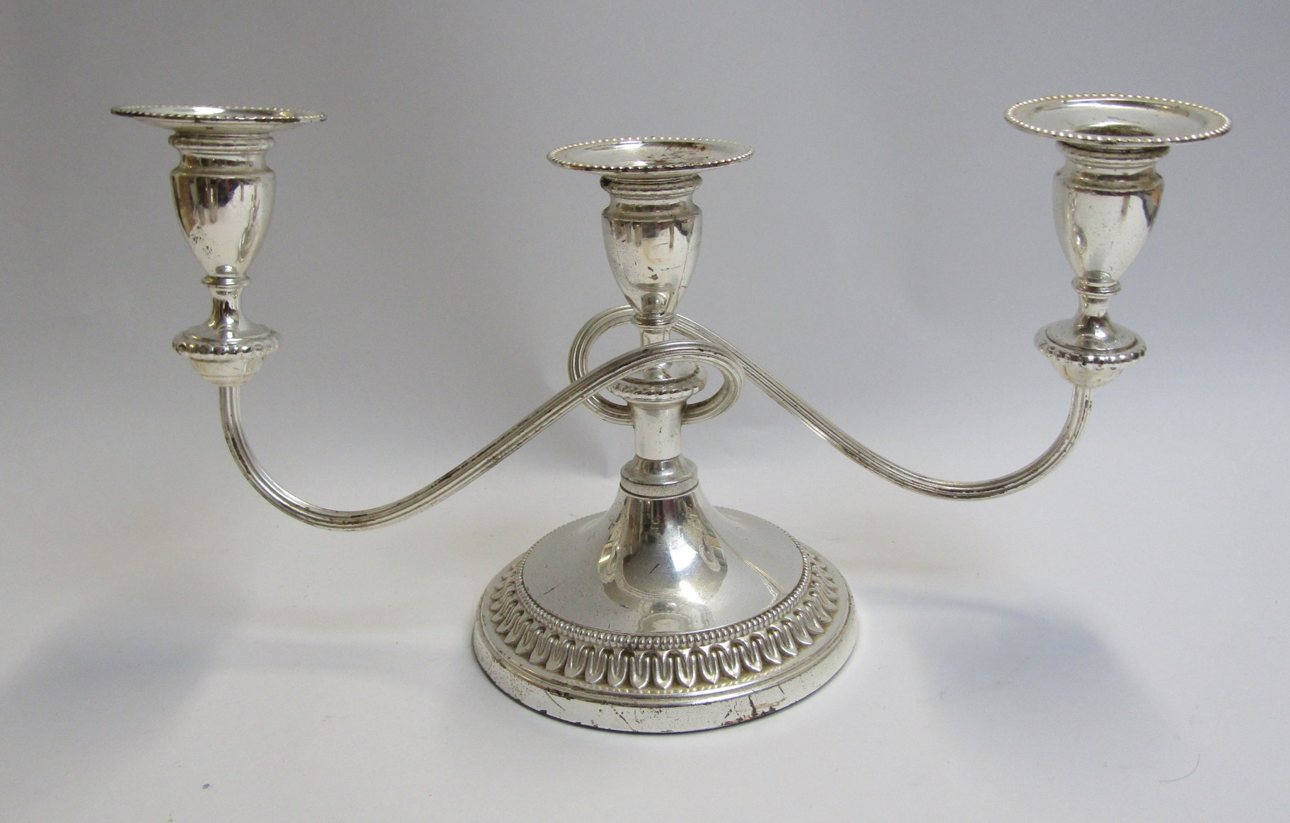 A silver plate three piece tea set and candlestick - Image 2 of 3